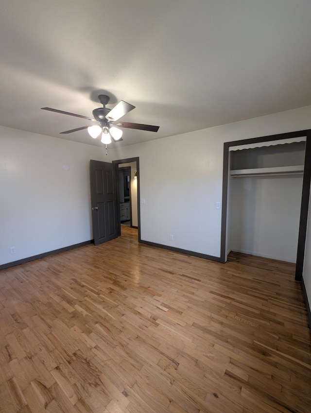 600 N Main St, Pleasant Hope, MO 65725 - unfurnished bedroom with light wood finished floors, a closet, and a ceiling fan