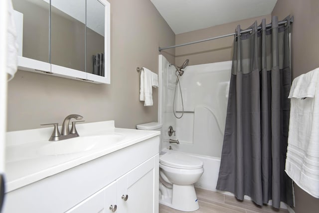 3229 W Hanover St, Springfield, MO 65807 - full bathroom featuring vanity, shower / tub combo, and wood finished floors