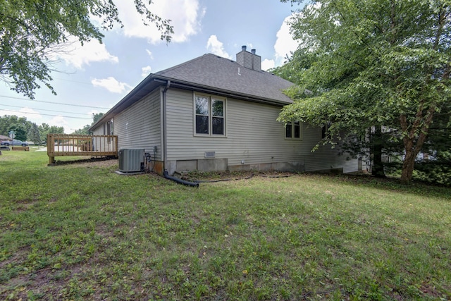 3229 W Hanover St, Springfield, MO 65807 - view of property exterior with a chimney, a yard, roof with shingles, and a wooden deck