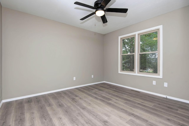 3229 W Hanover St, Springfield, MO 65807 - spare room featuring wood finished floors and ceiling fan