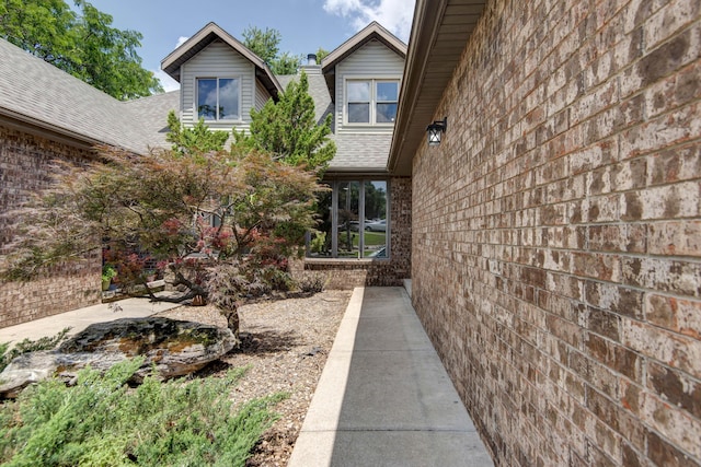 3229 W Hanover St, Springfield, MO 65807 - property entrance featuring brick siding and roof with shingles