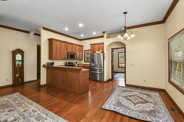 760 S 21st Ave, Ozark, MO 65721 - kitchen with stainless steel appliances, a peninsula, ornamental molding, brown cabinets, and dark wood finished floors