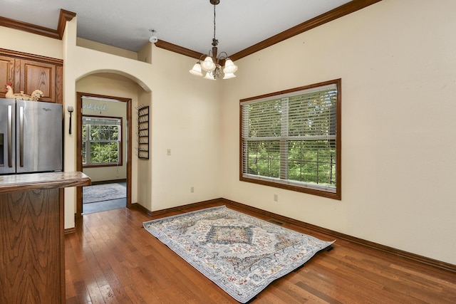 760 S 21st Ave, Ozark, MO 65721 - dining space with arched walkways, a chandelier, dark wood finished floors, and crown molding