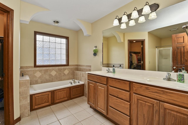 760 S 21st Ave, Ozark, MO 65721 - bathroom with a spacious closet, tile patterned flooring, double vanity, a garden tub, and a shower stall