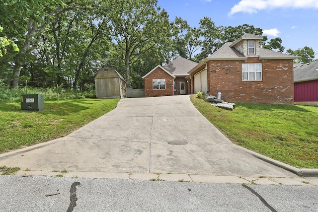 760 S 21st Ave, Ozark, MO 65721 - view of front facade with driveway, brick siding, a front yard, a storage shed, and an attached garage