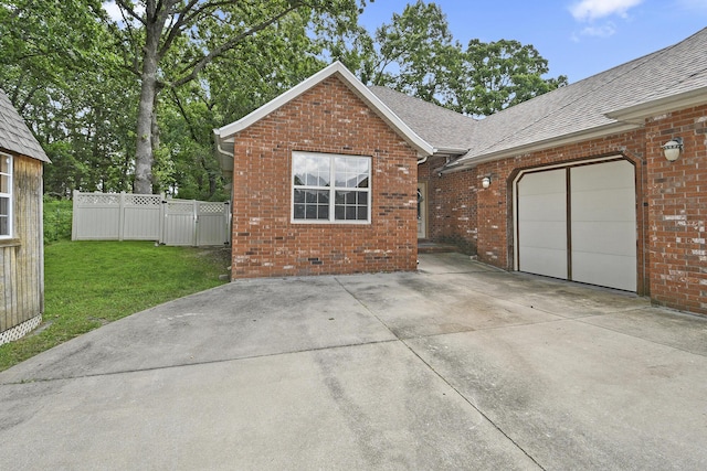 760 S 21st Ave, Ozark, MO 65721 - view of front of home with brick siding, a shingled roof, an attached garage, and concrete driveway