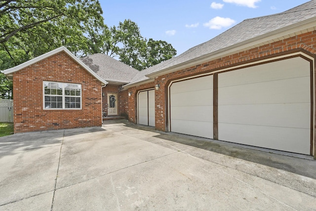 760 S 21st Ave, Ozark, MO 65721 - view of front of property with brick siding, roof with shingles, an attached garage, and concrete driveway