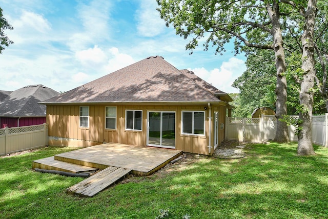 760 S 21st Ave, Ozark, MO 65721 - back of house featuring board and batten siding, a fenced backyard, a wooden deck, and a shingled roof