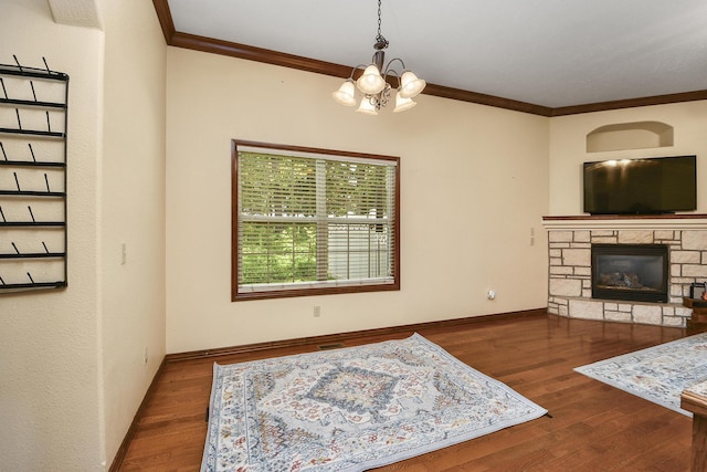 760 S 21st Ave, Ozark, MO 65721 - living area featuring a chandelier, crown molding, a fireplace, and wood finished floors