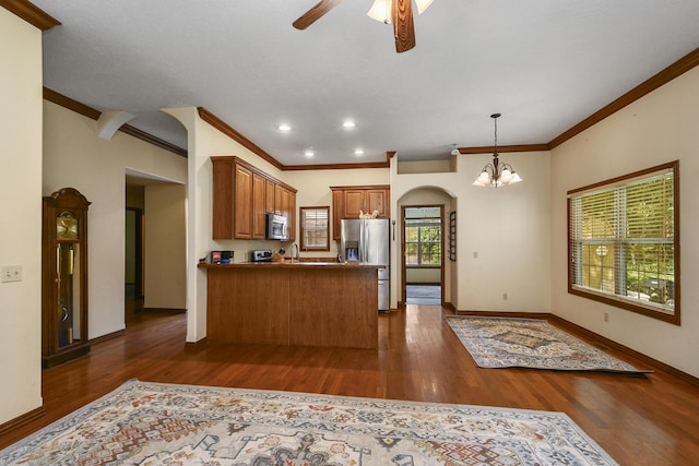 760 S 21st Ave, Ozark, MO 65721 - kitchen with appliances with stainless steel finishes, arched walkways, a ceiling fan, brown cabinets, and crown molding
