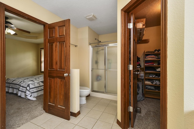 760 S 21st Ave, Ozark, MO 65721 - bathroom with a stall shower, tile patterned floors, a spacious closet, and connected bathroom