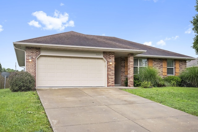 3262 E Colonial St, Republic, MO 65738 - single story home featuring brick siding, a garage, concrete driveway, a front yard, and a shingled roof