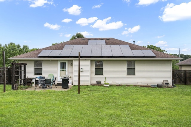 3262 E Colonial St, Republic, MO 65738 - back of house with solar panels, a patio area, a fenced backyard, and roof with shingles