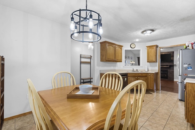 3262 E Colonial St, Republic, MO 65738 - dining space with light tile patterned floors and a chandelier