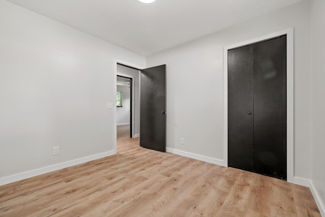 302 W Howard Ave, Billings, MO 65610 - unfurnished bedroom with wood finished floors and a closet