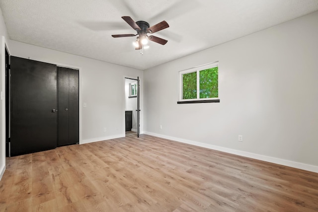 302 W Howard Ave, Billings, MO 65610 - unfurnished bedroom with light wood finished floors and ceiling fan