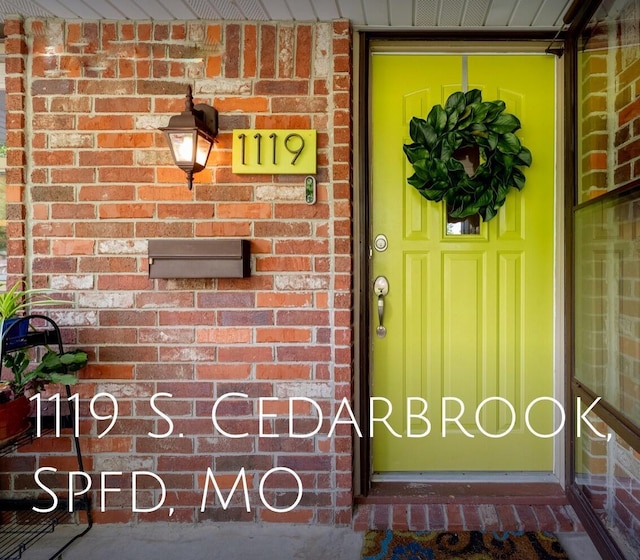 1119 S Cedarbrook Ave, Springfield, MO 65804 - entrance to property featuring brick siding