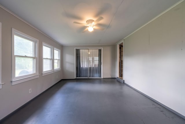 1119 S Cedarbrook Ave, Springfield, MO 65804 - spare room featuring finished concrete floors, ceiling fan, and ornamental molding