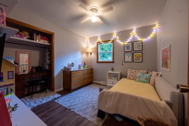 1119 S Cedarbrook Ave, Springfield, MO 65804 - bedroom with wood finished floors, a ceiling fan, and a textured ceiling