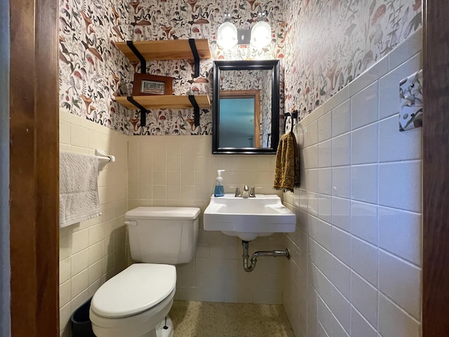 1119 S Cedarbrook Ave, Springfield, MO 65804 - bathroom featuring wallpapered walls, tile walls, and a wainscoted wall