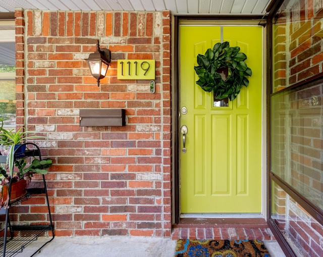 1119 S Cedarbrook Ave, Springfield, MO 65804 - doorway to property featuring brick siding