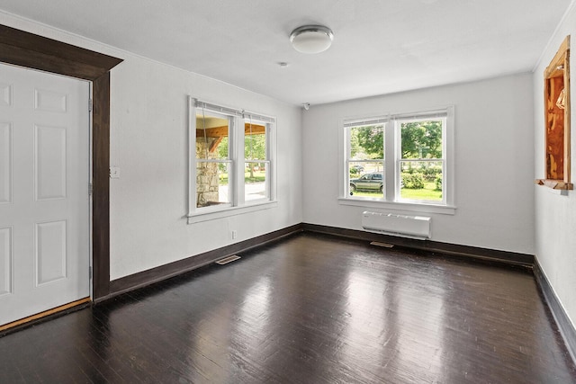 2101 N Main Ave, Springfield, MO 65803 - empty room with dark wood-type flooring and a wall mounted AC