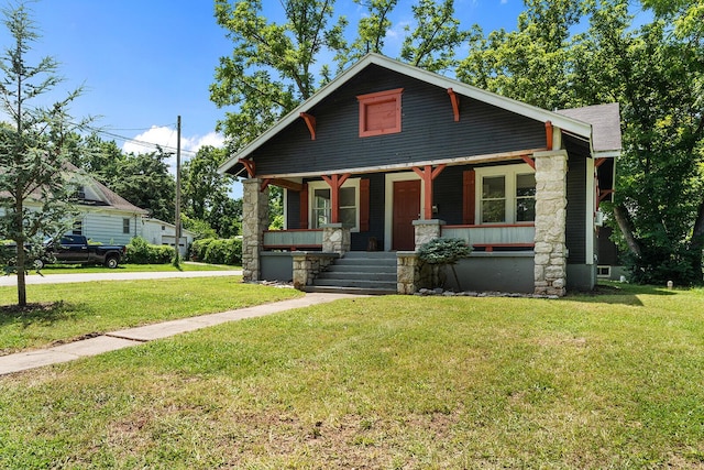 2101 N Main Ave, Springfield, MO 65803 - view of front of house featuring a porch and a front yard