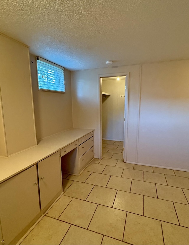 311 Crestwood Dr, Neosho, MO 64850 - unfurnished office featuring a textured ceiling and light tile patterned floors