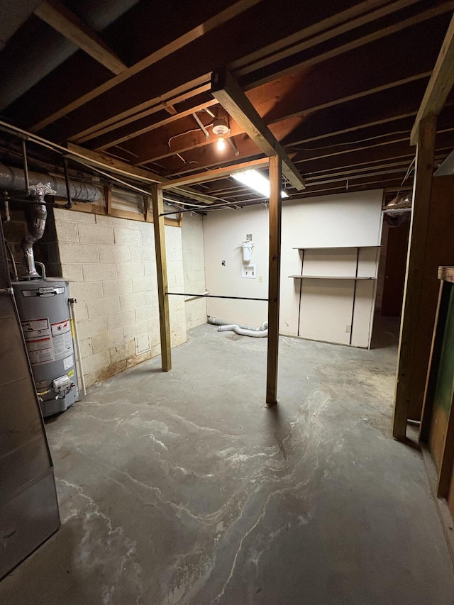 311 Crestwood Dr, Neosho, MO 64850 - unfinished basement with gas water heater and concrete block wall