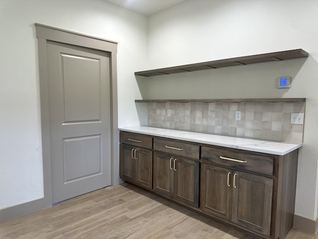 1988 Morris Rd Unit B, Mountain Grove, MO 65711 - bar featuring light wood finished floors and backsplash