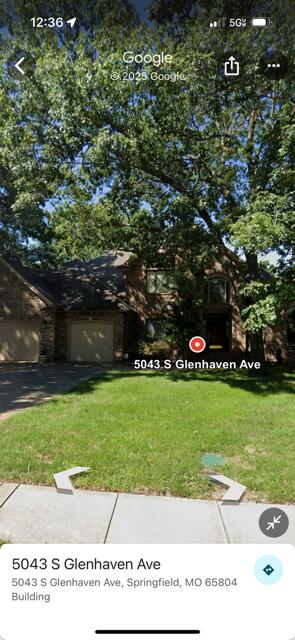 5043 S Glenhaven Ave, Springfield, MO 65804 - view of grassy yard with a garage