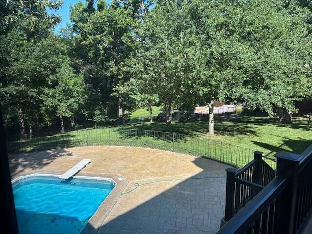 5043 S Glenhaven Ave, Springfield, MO 65804 - view of swimming pool with a diving board, a yard, and a patio