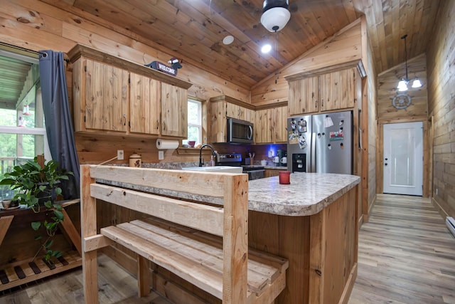 119 Allison Bnd, Lampe, MO 65681 - kitchen with appliances with stainless steel finishes, vaulted ceiling, wooden ceiling, light countertops, and light wood-style floors