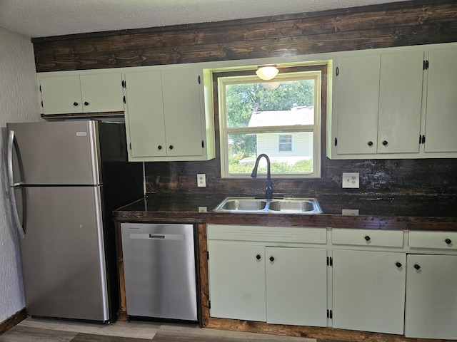 401 Walnut St, Ava, MO 65608 - kitchen featuring appliances with stainless steel finishes, dark countertops, wood finished floors, and backsplash