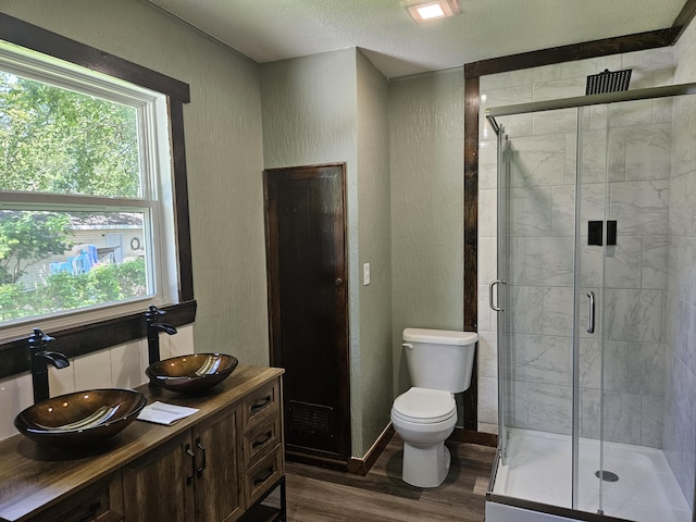 401 Walnut St, Ava, MO 65608 - full bath with wood finished floors, a stall shower, vanity, and a textured ceiling