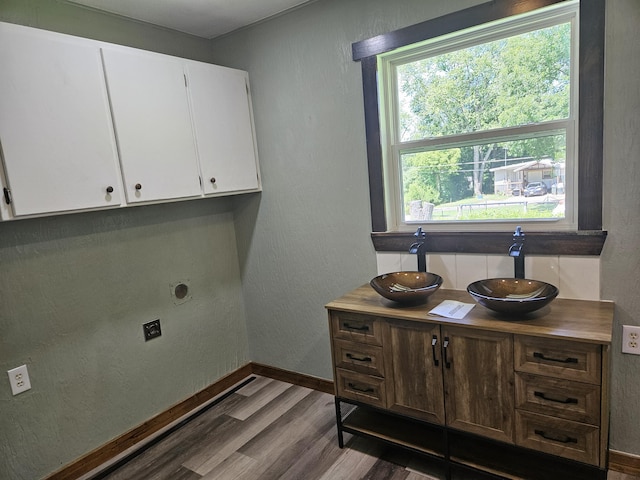 401 Walnut St, Ava, MO 65608 - laundry area with a sink and wood finished floors