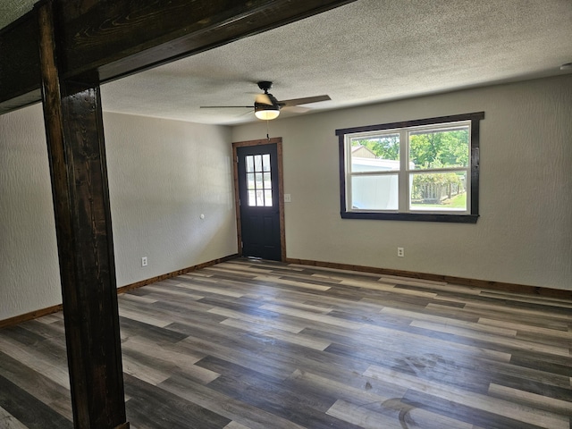 401 Walnut St, Ava, MO 65608 - entryway with wood finished floors, a textured ceiling, and a ceiling fan