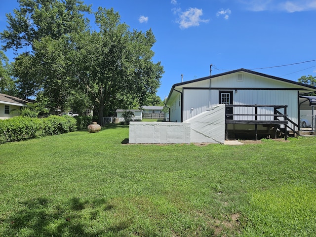 401 Walnut St, Ava, MO 65608 - view of grassy yard featuring a deck