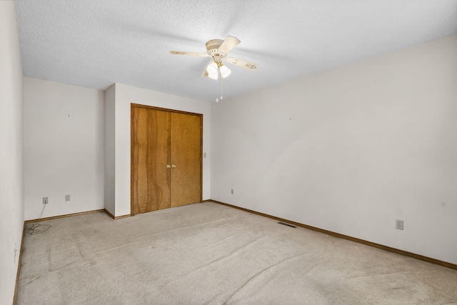 4059 E Linwood St, Springfield, MO 65809 - unfurnished bedroom with carpet floors, a closet, a ceiling fan, and a textured ceiling