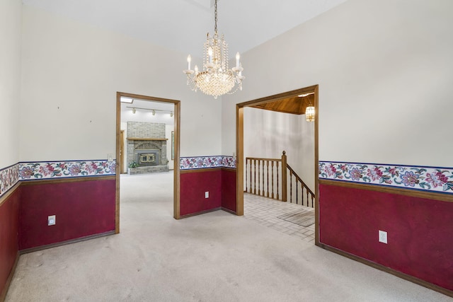 4059 E Linwood St, Springfield, MO 65809 - spare room featuring a chandelier, carpet, a wainscoted wall, and wallpapered walls