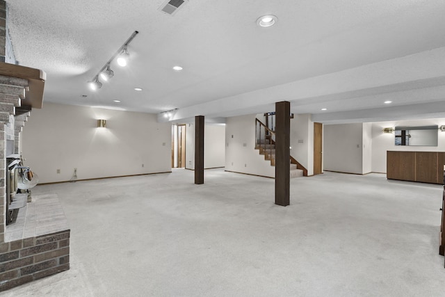 4059 E Linwood St, Springfield, MO 65809 - finished basement with stairs, recessed lighting, carpet, and a textured ceiling