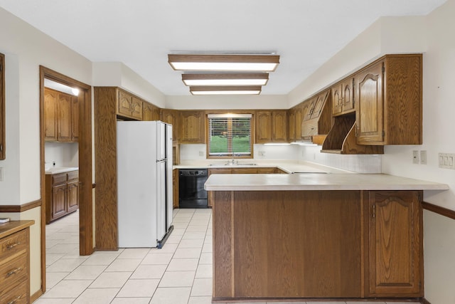 4059 E Linwood St, Springfield, MO 65809 - kitchen featuring freestanding refrigerator, dishwasher, a peninsula, and light countertops