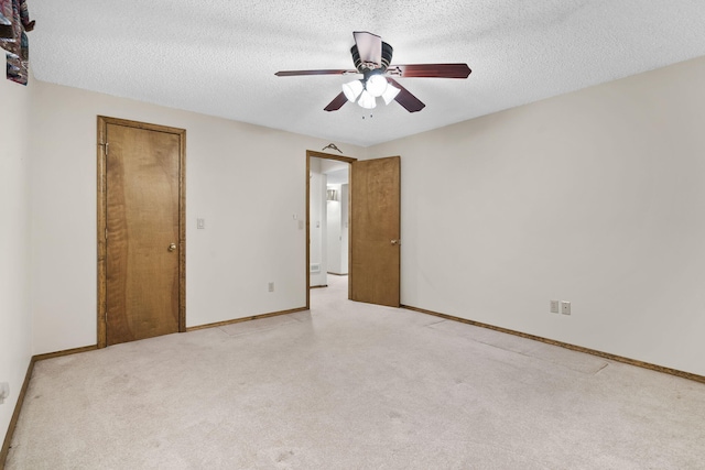 4059 E Linwood St, Springfield, MO 65809 - unfurnished bedroom featuring light carpet, a textured ceiling, and ceiling fan