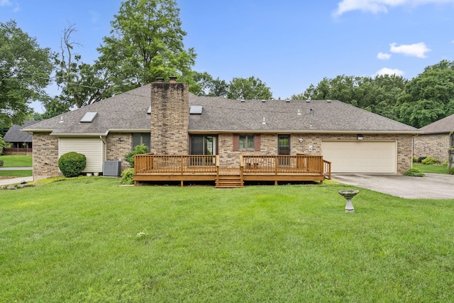 4059 E Linwood St, Springfield, MO 65809 - rear view of house featuring brick siding, a chimney, a yard, and a garage