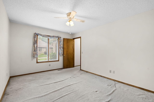 4059 E Linwood St, Springfield, MO 65809 - empty room with carpet floors, a ceiling fan, and a textured ceiling