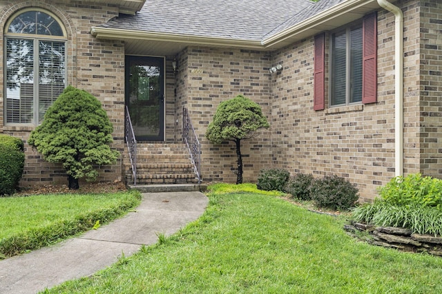4059 E Linwood St, Springfield, MO 65809 - entrance to property featuring a shingled roof, a yard, and brick siding
