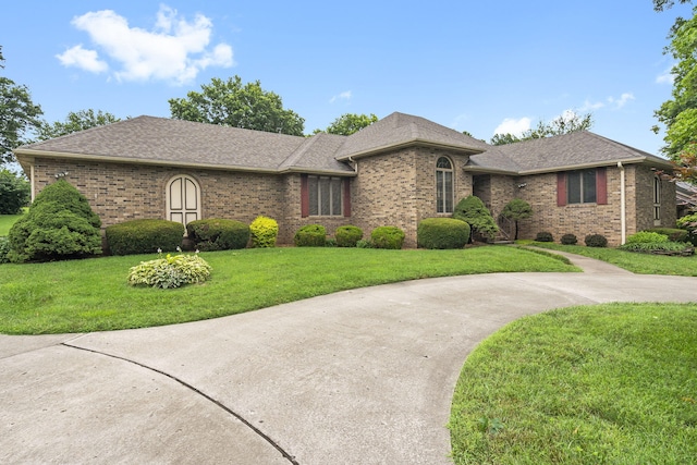 4059 E Linwood St, Springfield, MO 65809 - ranch-style home with brick siding, a front yard, and a shingled roof