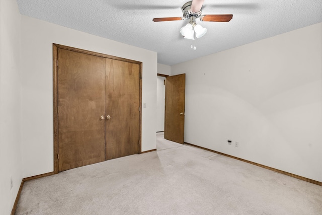 4059 E Linwood St, Springfield, MO 65809 - unfurnished bedroom featuring light carpet, a closet, a textured ceiling, and a ceiling fan