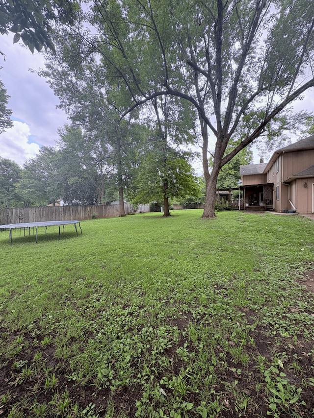 2412 S Camber Ave, Springfield, MO 65809 - fenced backyard featuring a trampoline
