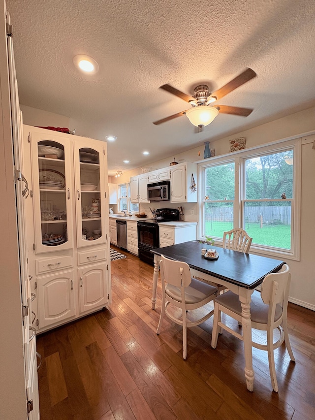 2412 S Camber Ave, Springfield, MO 65809 - dining space with a textured ceiling, dark wood-type flooring, ceiling fan, and recessed lighting